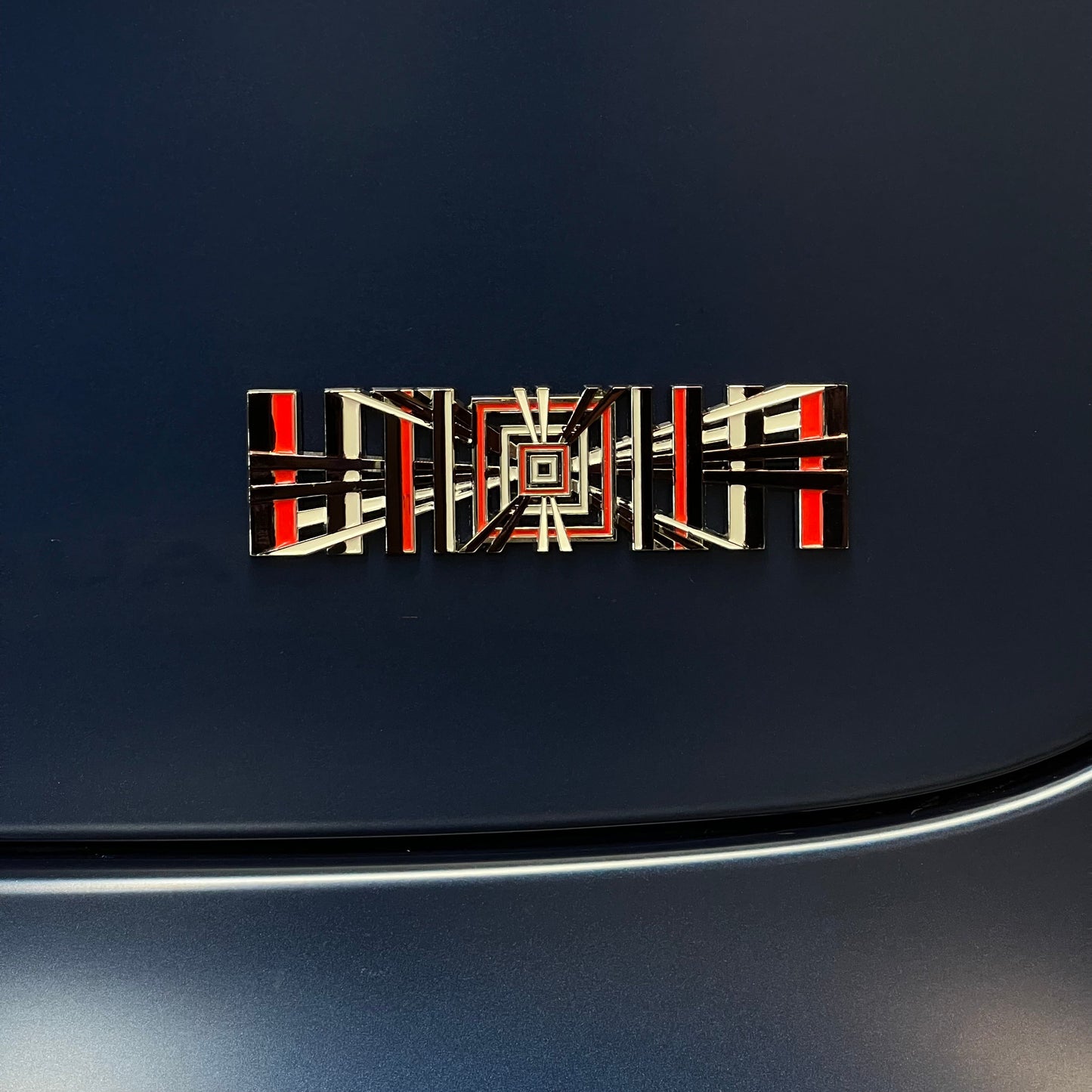 Tesla Plaid emblem